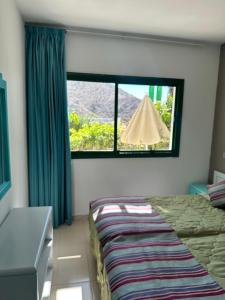 Ένα ή περισσότερα κρεβάτια σε δωμάτιο στο SOL VELEROS Puerto Rico Apartement +7 φωτογραφίες