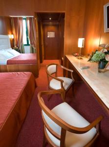 Postel nebo postele na pokoji v ubytování AS Hotel Monza
