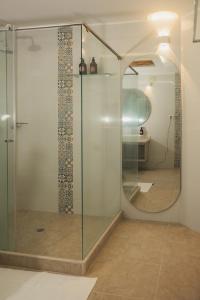 a shower with a glass door in a bathroom at Casa Serena in Ibagué +35 photos