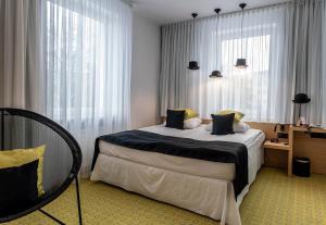 Posteľ alebo postele v izbe v ubytovaní Hotel Cristal Białystok