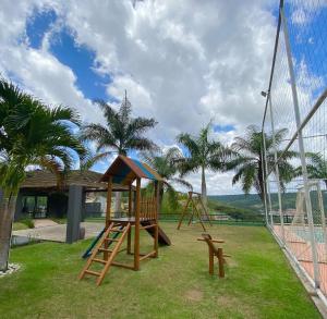 a playground with a slide and a goal at Apartamento de um quarto com varanda externa in Bananeiras
