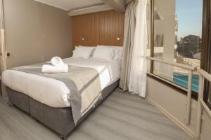 Postel nebo postele na pokoji v ubytování Mahia hotel Reñaca