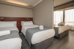 Postel nebo postele na pokoji v ubytování Mahia hotel Reñaca