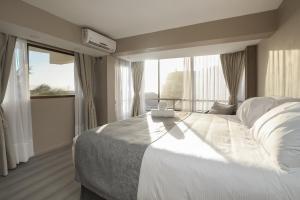 Postel nebo postele na pokoji v ubytování Mahia hotel Reñaca