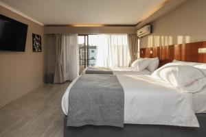 Postel nebo postele na pokoji v ubytování Mahia hotel Reñaca