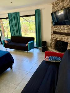 TV a/nebo společenská místnost v ubytování Ohana Punta Ballena cero nueve seis cuatro dieciocho quinientos ochenta y uno