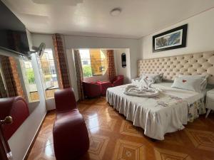 Ένα ή περισσότερα κρεβάτια σε δωμάτιο στο Hostal Amazonas