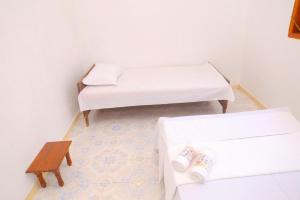 Postel nebo postele na pokoji v ubytování Lily Garden Home