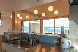 Kuchyň nebo kuchyňský kout v ubytování Beach SPA TSUDA 0 Cero棟