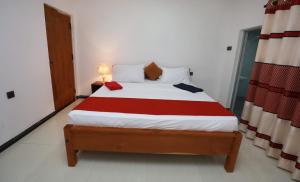 Postel nebo postele na pokoji v ubytování Alankulama Wana Resort