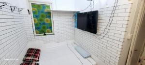 a bath tub in a bathroom with a window at Room , Partition room , Partition , Master room in Dubai