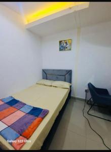 a bedroom with a bed and a blue chair at Room , Partition room , Partition , Master room in Dubai