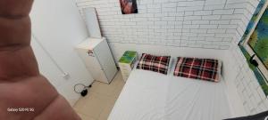 a kitchen with two plaid towels on the wall at Room , Partition room , Partition , Master room in Dubai
