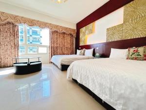 Postel nebo postele na pokoji v ubytování 花蓮洄瀾雅舍民宿-近火車站