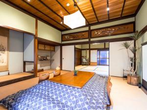 Кровать или кровати в номере 平田屋 明治の間 -Hirataya Meiji- 父母ケ浜4分