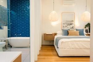Katil atau katil-katil dalam bilik di Aquabelle Apartments