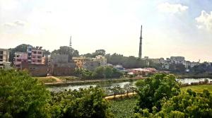 a view of a city with a river and buildings at Varanasi River View Holiday Homestay Dormitory and Hostel in Varanasi