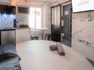 Kuchyň nebo kuchyňský kout v ubytování Le Saphir Spa & Jacuzzi
