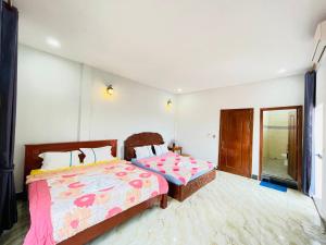 Postel nebo postele na pokoji v ubytování Golden Lady Hostel