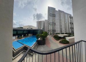 a balcony of a building with a swimming pool at Full 1 BHK near Aster hospital hebbal in Bangalore