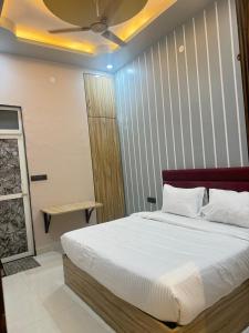 Ένα ή περισσότερα κρεβάτια σε δωμάτιο στο LD Prime Hotel