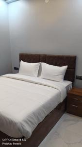 Ένα ή περισσότερα κρεβάτια σε δωμάτιο στο LD Prime Hotel