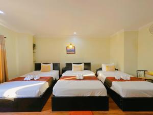 Postel nebo postele na pokoji v ubytování Leng Sengna Hotel