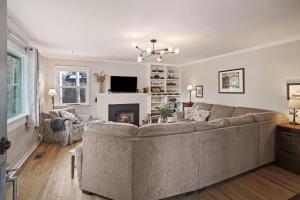 a living room with a couch and a fireplace at NW Nest 30 Day Minimum in Bend