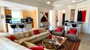 a living room with a couch and a table at Double Eagle in Rancho Mirage
