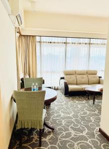 A seating area at TaheeenS Suites at Berjaya Times Square