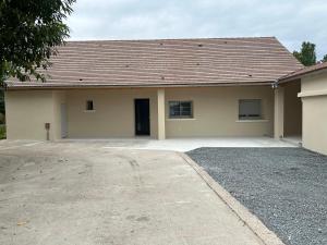 a house with a driveway in front of it at La Chardonnière in Seigy
