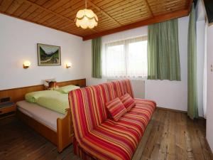 Ένα ή περισσότερα κρεβάτια σε δωμάτιο στο Apartment in Hippach near Horbergbahn