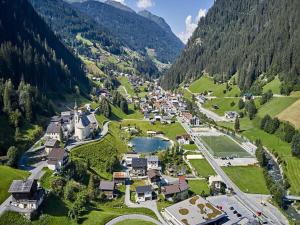 an aerial view of a village in the mountains at Apartment in See near Bathing Lake in See