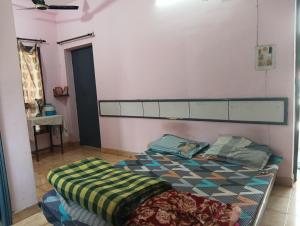 a bedroom with a bed in a room at New sharma homestay in Prayagraj +5 photos