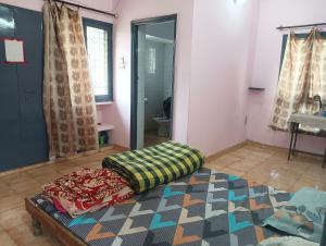 a room with a mattress on the floor in a room at New sharma homestay in Prayagraj