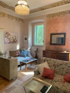 a living room with a couch and a table at Todi Villa San Martino in Todi