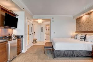a hotel room with a bed and a kitchen at The Rosé II MGM Signature Studio Suite Tower 3 in Las Vegas
