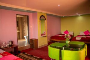 Voodi või voodid majutusasutuse Summit Hotel Ilam toas