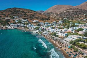 an aerial view of a beach with buildings and the ocean at Michael's Home Cycladic Cottage House in Kini