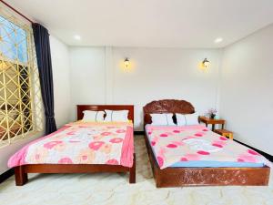 Postel nebo postele na pokoji v ubytování Golden Lady Hostel