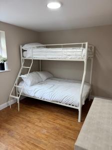 a bedroom with two bunk beds in a room at Cosy Cloud in Congleton +21 photos