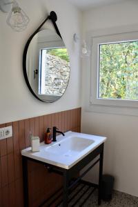 a bathroom with a sink and a mirror at Casa San Martino in Arizzano