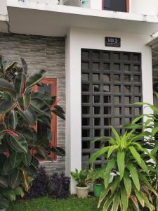 a front door of a house with plants at Ambarukmo Green Hill / MA 8 in Yogyakarta
