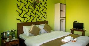 Voodi või voodid majutusasutuse Summit Hotel Ilam toas