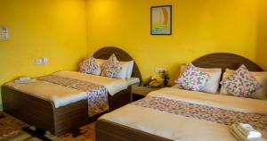 Voodi või voodid majutusasutuse Summit Hotel Ilam toas