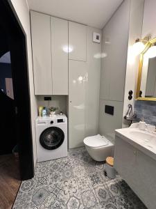 Koupelna v ubytování Apartament Z Ogrodem - Paderewskiego 22 + 18 fotografií