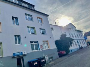 a white building on the side of a street at Gästehaus Wilhelma in Gießen