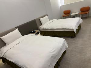 Voodi või voodid majutusasutuse Ya Nold Hot Spring Hotel toas