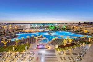 a large pool with umbrellas in a resort at Pickalbatros Royal Moderna Sharm "Aqua Park"- All inclusive in Sharm El Sheikh