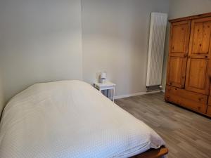 Posteľ alebo postele v izbe v ubytovaní Le garage